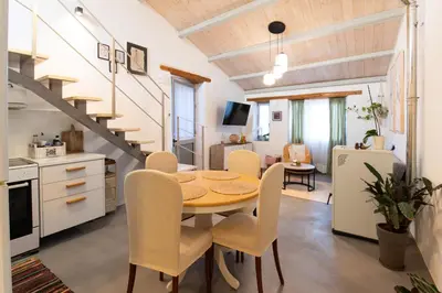 a kitchen and dining room with a table and chairs at Casa Ellini unique & spacious by 8essentially in Kókkinos Pírgos