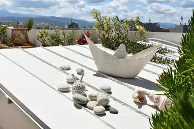 a toy boat sitting on top of a roof at Diotima - Astonishing seaview apartment in Chania Town