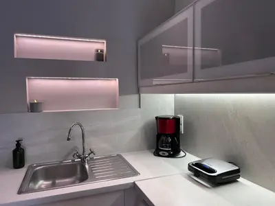a kitchen with a sink and a coffee maker on a counter at Elias Nest in Galatás