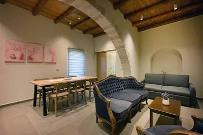 a living room with a couch and a table at Evans Villas in Kissamos