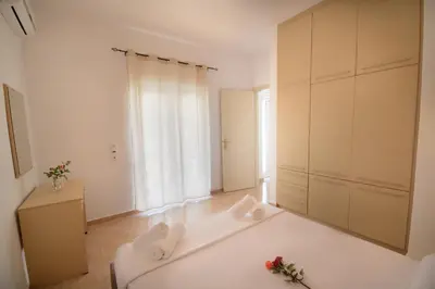 a white room with a large white tub in a room at Villa Silvia by Andrian Villas in Kalamítsion Alexándrou