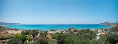a view of a beach and the ocean at Elia Suites in Falasarna