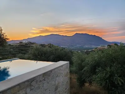 a swimming pool with a view of a mountain at Villa Simera, with pool & great view in Fournádhos