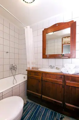 a bathroom with a sink and a tub and a toilet at Kallimento-Dimitra in Kissamos