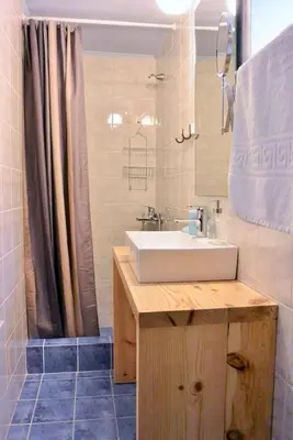 a bathroom with a sink and a shower at Casa Di Porto Vecchio in Chania Town