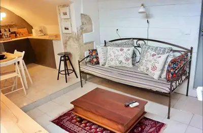 a living room with a couch and a table at Casa Di Porto Vecchio in Chania Town