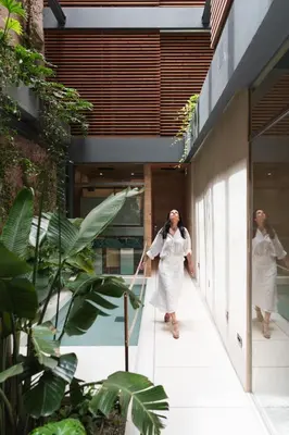 two women walking down a hallway in a building at Elysia Boutique Hotel in Chania Town