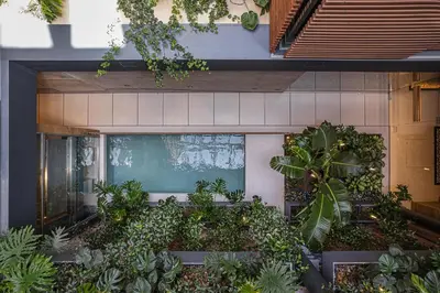 an indoor garden with plants in a building at Elysia Boutique Hotel in Chania Town