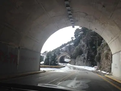 a tunnel over a road with a mountain at Sea Sight Vibes in Frangokastello