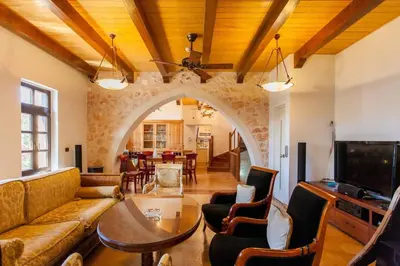 a living room with a couch and a table at Luxurious Venetian 3 FLOOR HOUSE in the old port in Chania Town
