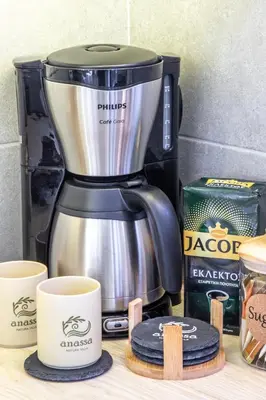 a coffee maker sitting on a counter with two cups at Anassa Natura Villa in Daratso