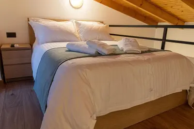 a bedroom with a bed with two towels on it at Sappho 3-bedroom House in Daratso
