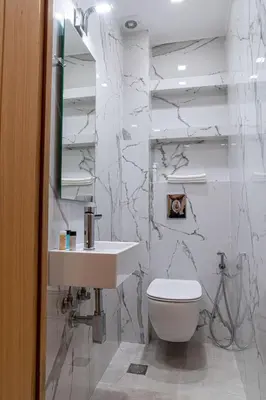a white bathroom with a sink and a toilet at Sappho 3-bedroom House in Daratso