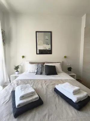 a bedroom with a large bed with two towels on it at Relax Private Pool House in Maleme
