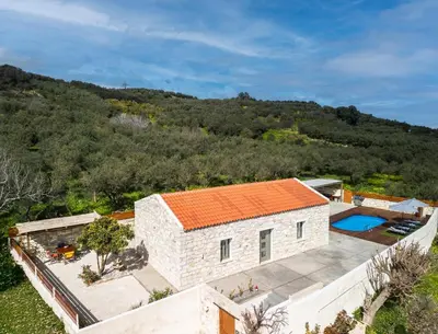 an aerial view of a stone house with an orange roof at Villa Lakioto in Dhémbla