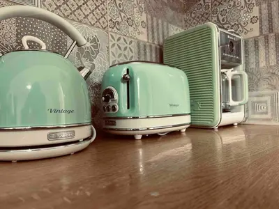 three toasters sitting on top of a wooden floor at Chania Vintage Escape - sea view Gem by old port in Chania Town