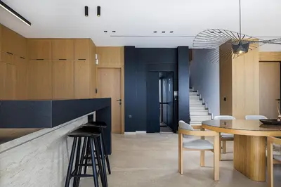 a kitchen with a table and chairs and a staircase at Etheria Elli Villa, Retreat to Ethereal Luxury and Wellness by etouri in CHQ