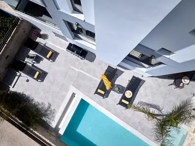 an overhead view of a swimming pool next to a building at Galanakis luxury villa in Chania Town