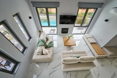 an overhead view of a living room with couches and windows at Galanakis luxury villa in Chania Town