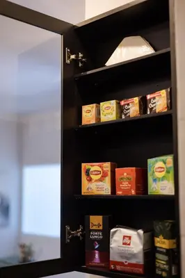 a shelf with food on it in a kitchen at Zen City Apartment in Chania Town