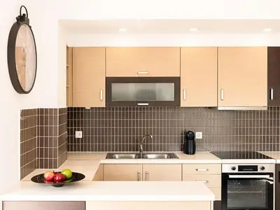 a kitchen with a bowl of fruit on a counter at Chania sea view apartment - Crete in Galatás