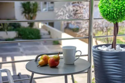 a table with two apples and a cup on it at Dreams 4 you in Chania Town