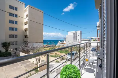 a balcony with a view of the ocean at Dreams 4 you in Chania Town