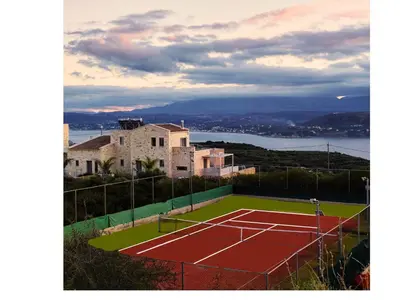 a tennis court on top of a house at Fantasea Villas, villa Lumi in Stérnai