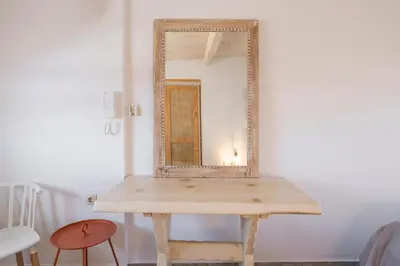 a wooden table with a mirror on top of it at Crescendo Splantzia in Chania Town
