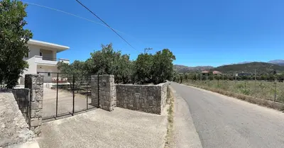 a fence on the side of a road at Melina's house in Skinés