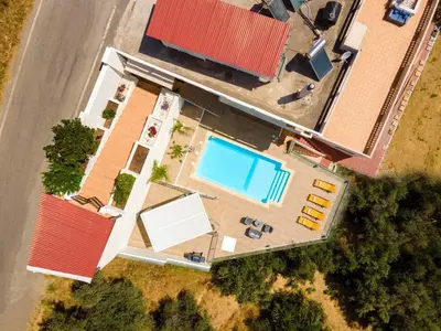 an overhead view of a house with a swimming pool at Lucia's Home in Stalos