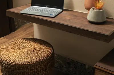 a laptop computer sitting on a desk with a chair at Raviewha Luxury Apartments 2 in Ravdhoúkha