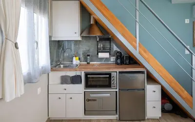 a small kitchen with a sink and a stove at View West Elafonisi house in Livadia