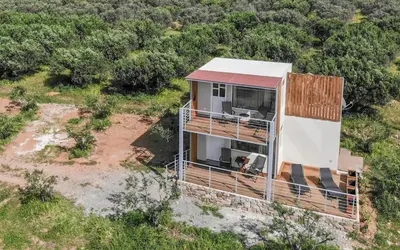 an aerial view of a house in the middle of a field at View West Elafonisi house in Livadia