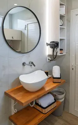a bathroom with a sink and a mirror at View West Elafonisi house in Livadia