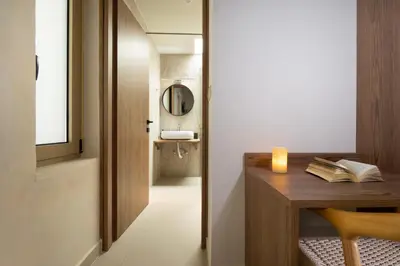 a room with a desk with a candle and a mirror at Villa George in Límni