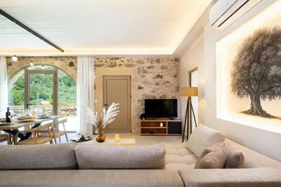a living room with a couch and a table at Villa George in Límni