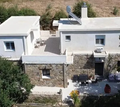 an aerial view of a white house with a patio at Petra Homes Temenia in Teménia