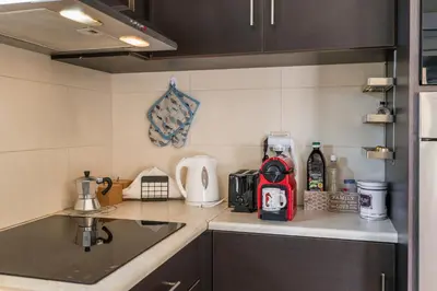 a kitchen with a sink and a counter top at Casa Barbara in Stalos