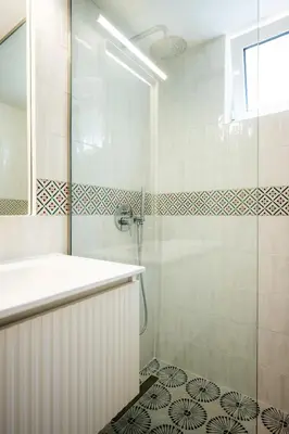 a bathroom with a shower and a sink at Bella Apartment in Chania Town