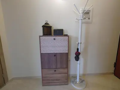 a room with a broom and a cabinet with a lamp at Lumen Chania in Chania Town