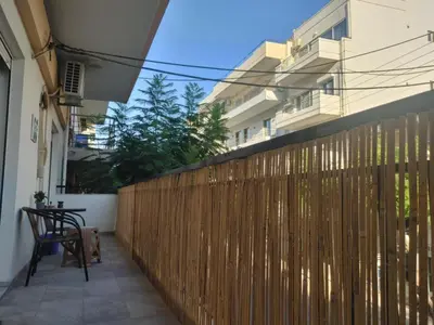 a wooden fence in front of a building at Lumen Chania in Chania Town