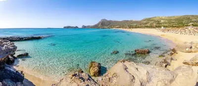 a view of a beach with rocks and the ocean at Elaida Home in Psathoyiánnos