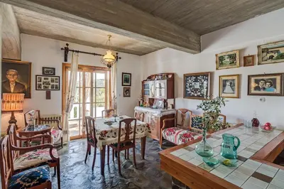 a dining room with a table and chairs at Lilly Traditional Cretan Villa in Dhrakóna