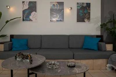 a living room with a couch and a table at Be Crete - Horizon in Chania Town