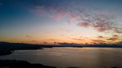 a sunset over a large body of water at Be Crete - Horizon in Chania Town