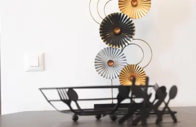 a table with three umbrellas on top of it at Luxury apartment Reverie in Sfakiá