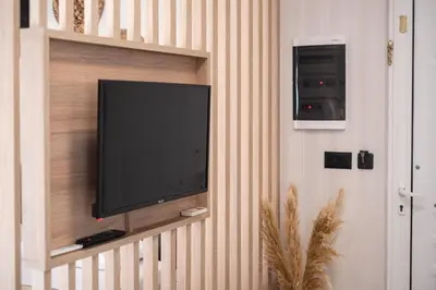 a flat screen tv hanging on a wall at Nektaria Studio in Chania Town