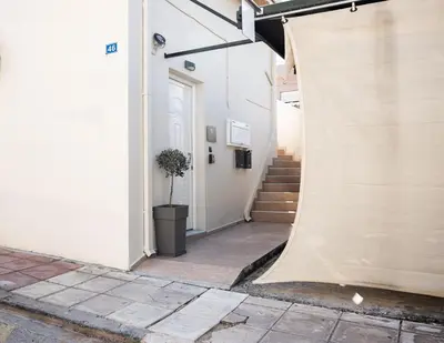 a building with a tarp on the side of it at Nektaria Studio in Chania Town