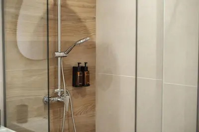 a shower with a glass door in a bathroom at Nektaria Studio in Chania Town